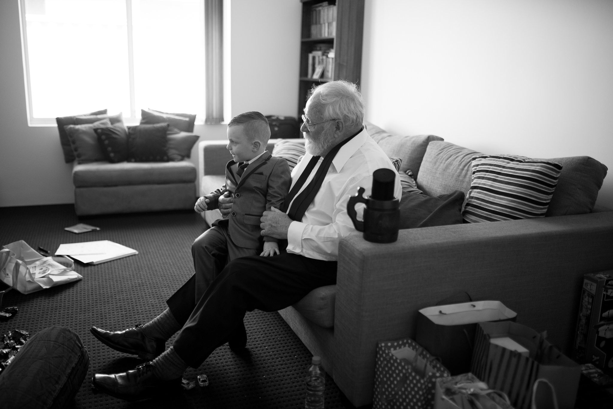 page boy sits with his grandpa