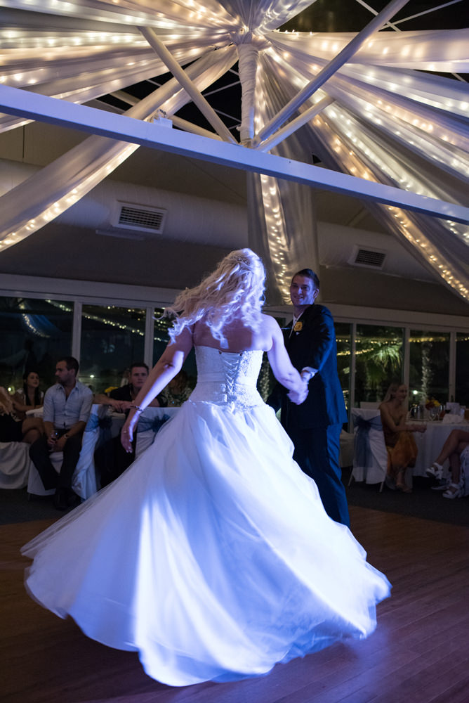 bride and groom dancing, spinning on the dance floor