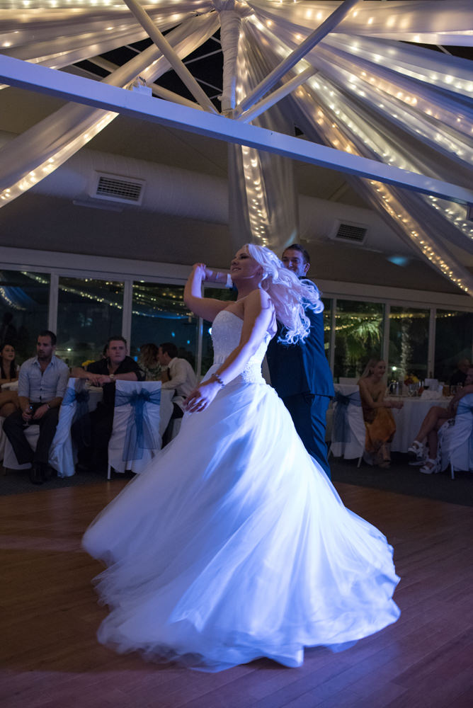 bride and groom dancing, spinning on the dance floor