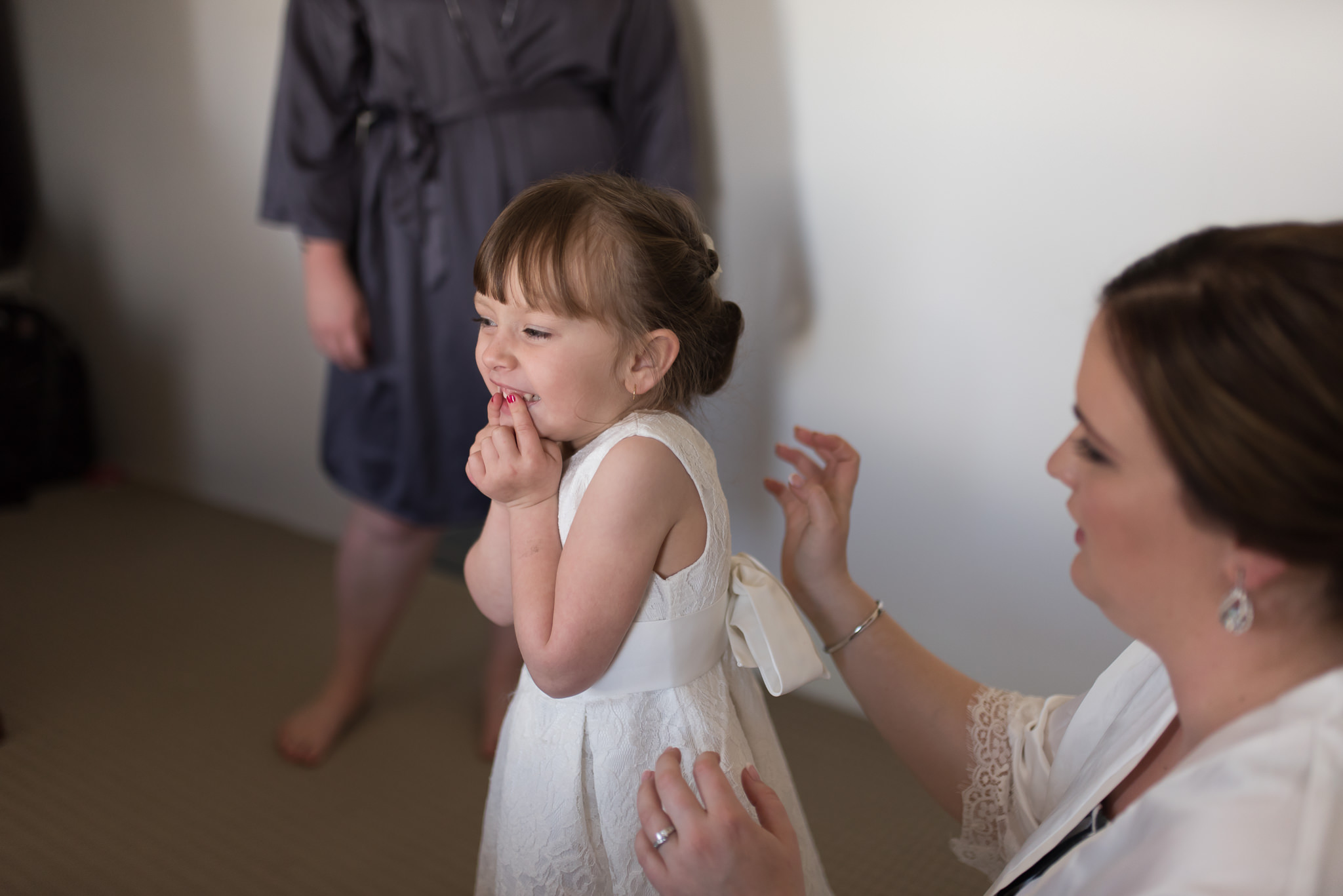 flower girl giggles getting ready for wedding