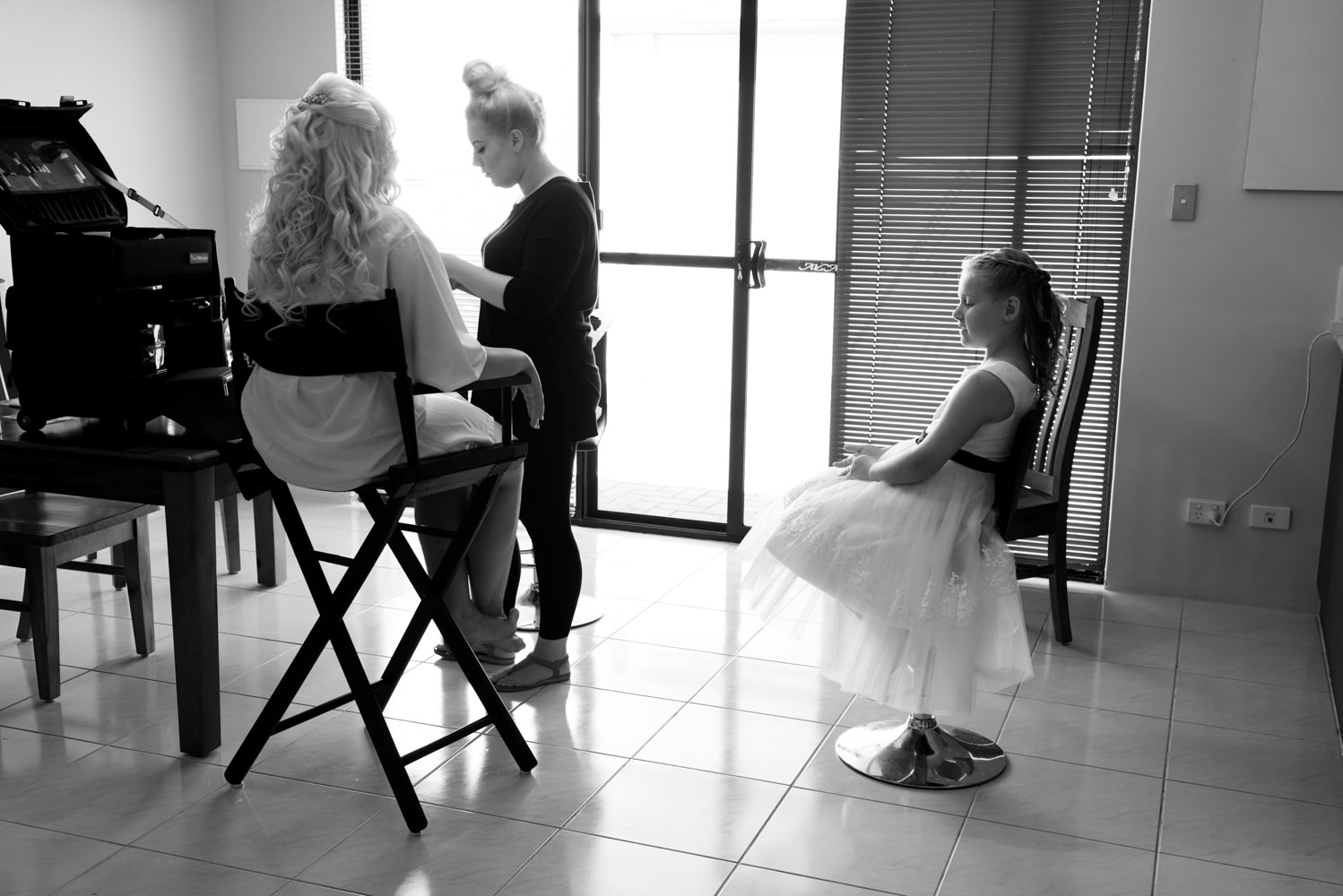 Bride having makeup done