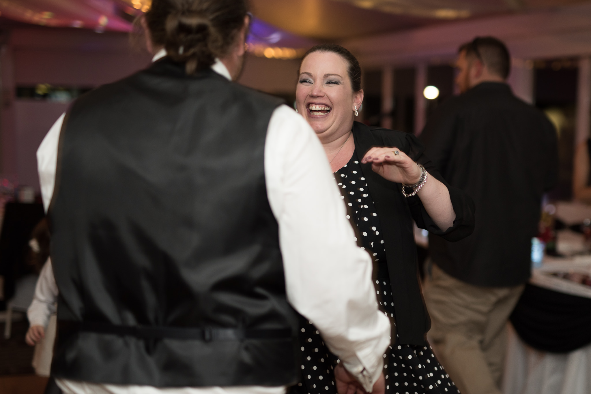 Wedding guest laughing and dancing at Joondalup wedding reception