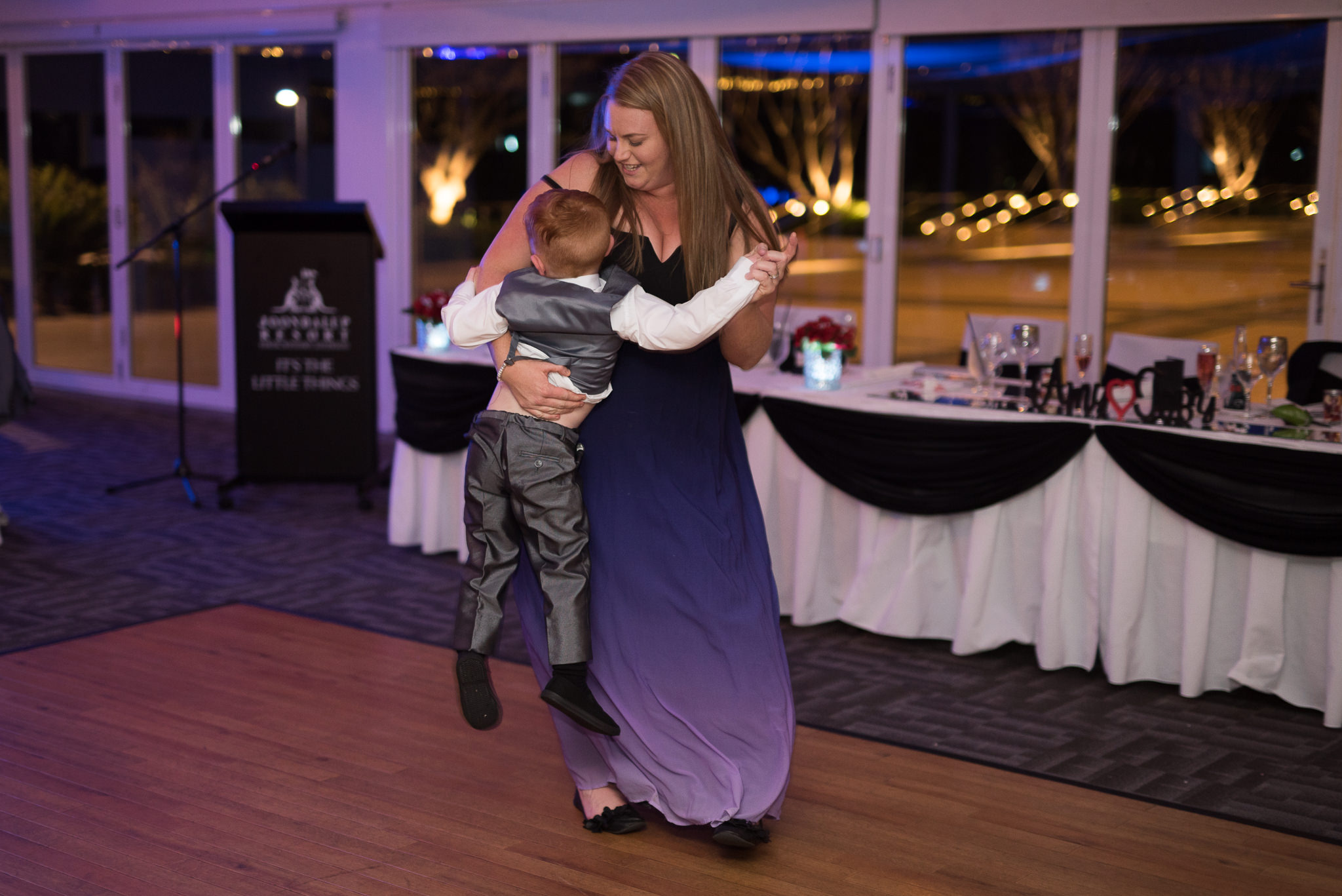 mother with her little boy dancing at wedding reception