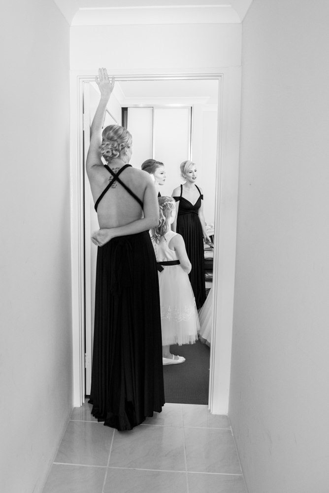 Elegant bridesmaid standing in doorway