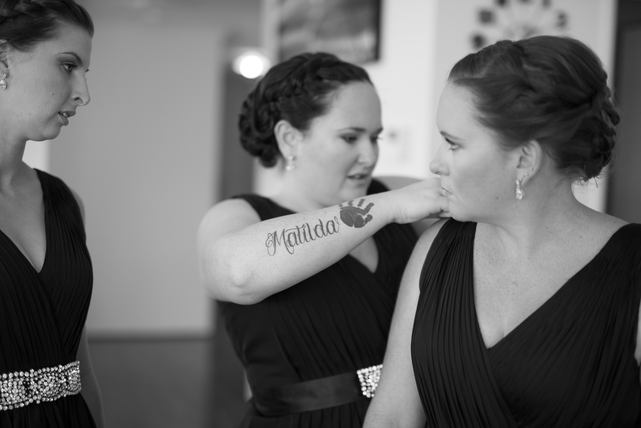 bridesmaid with a tattoo on her arm