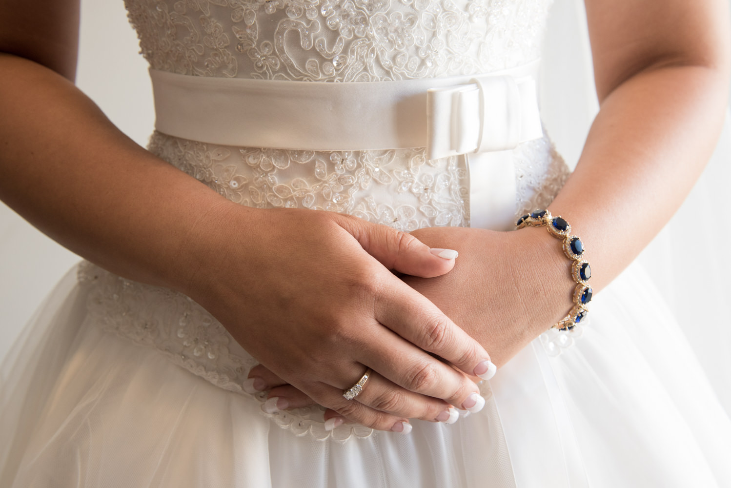 Close up of bride's hands with jewellery