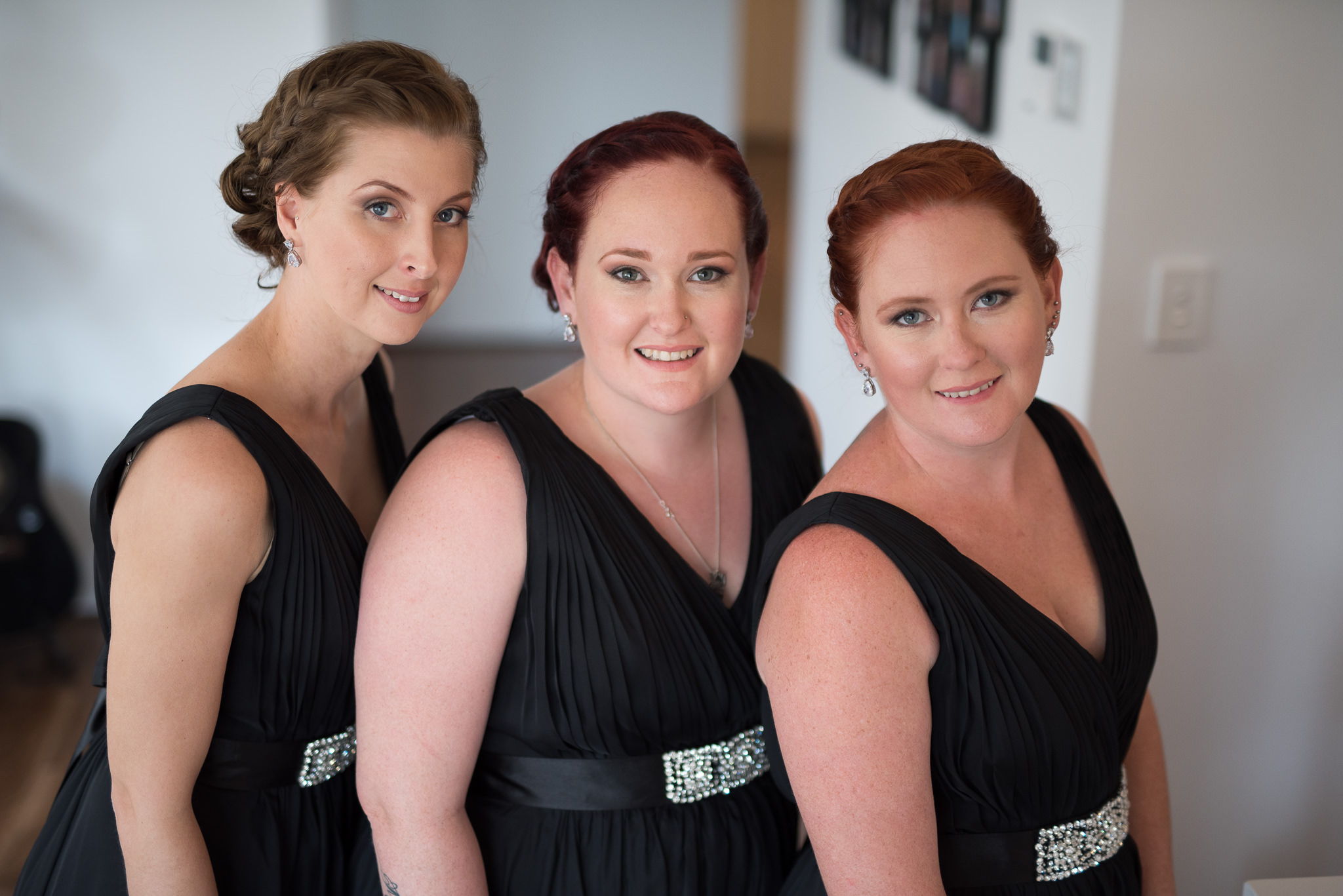 portrait of three bridesmaids in black dresses