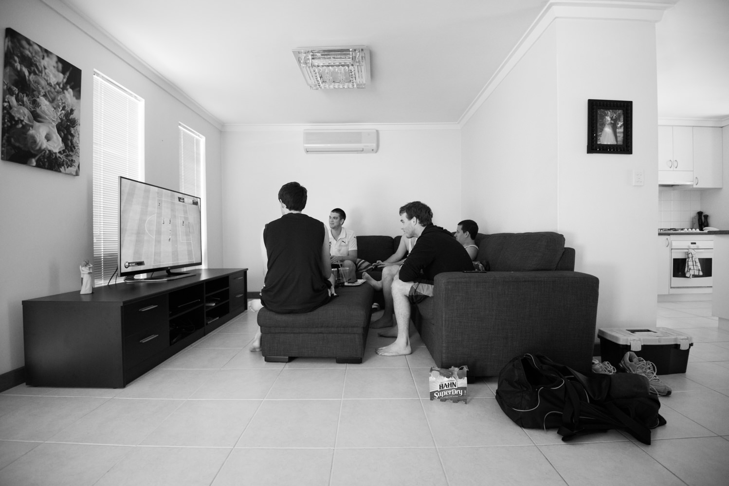 Groom with groomsmen playing computer games