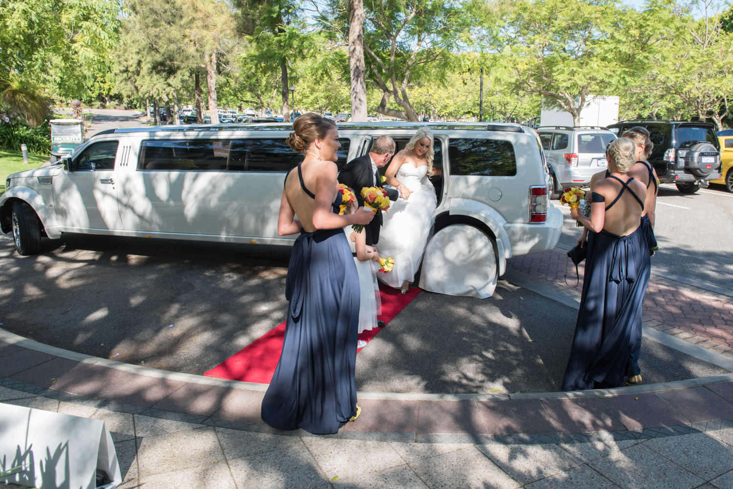 Bride gets out of the limousine