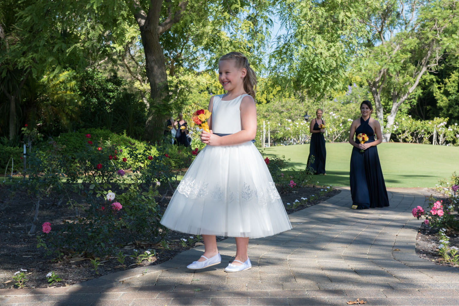 Flower girl walks down the aisle