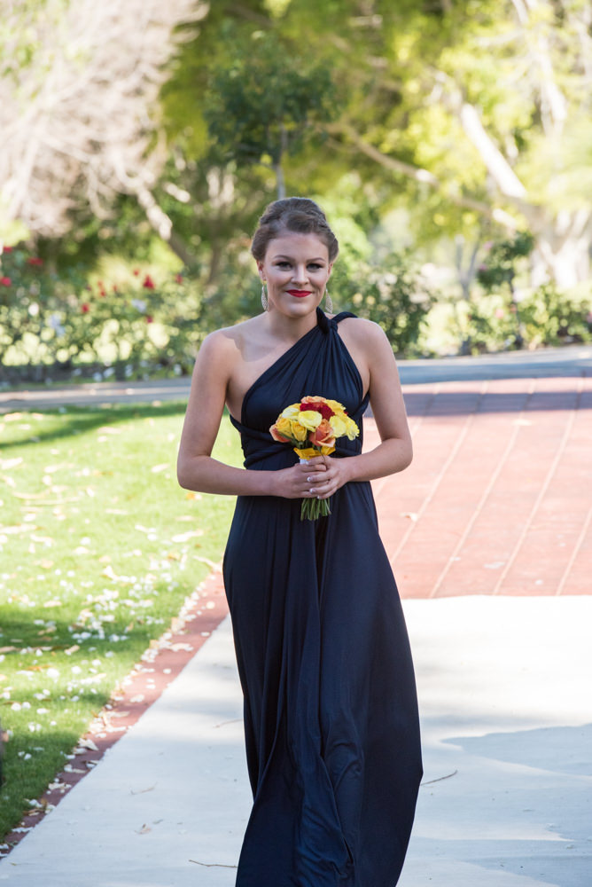 Maid of honour walks down the aisle