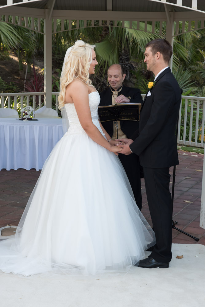 Bride and groom holding hands