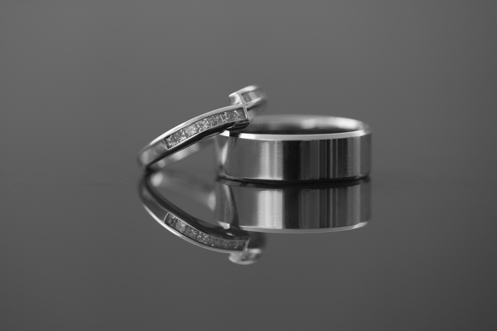 close up of wedding rings in black and white