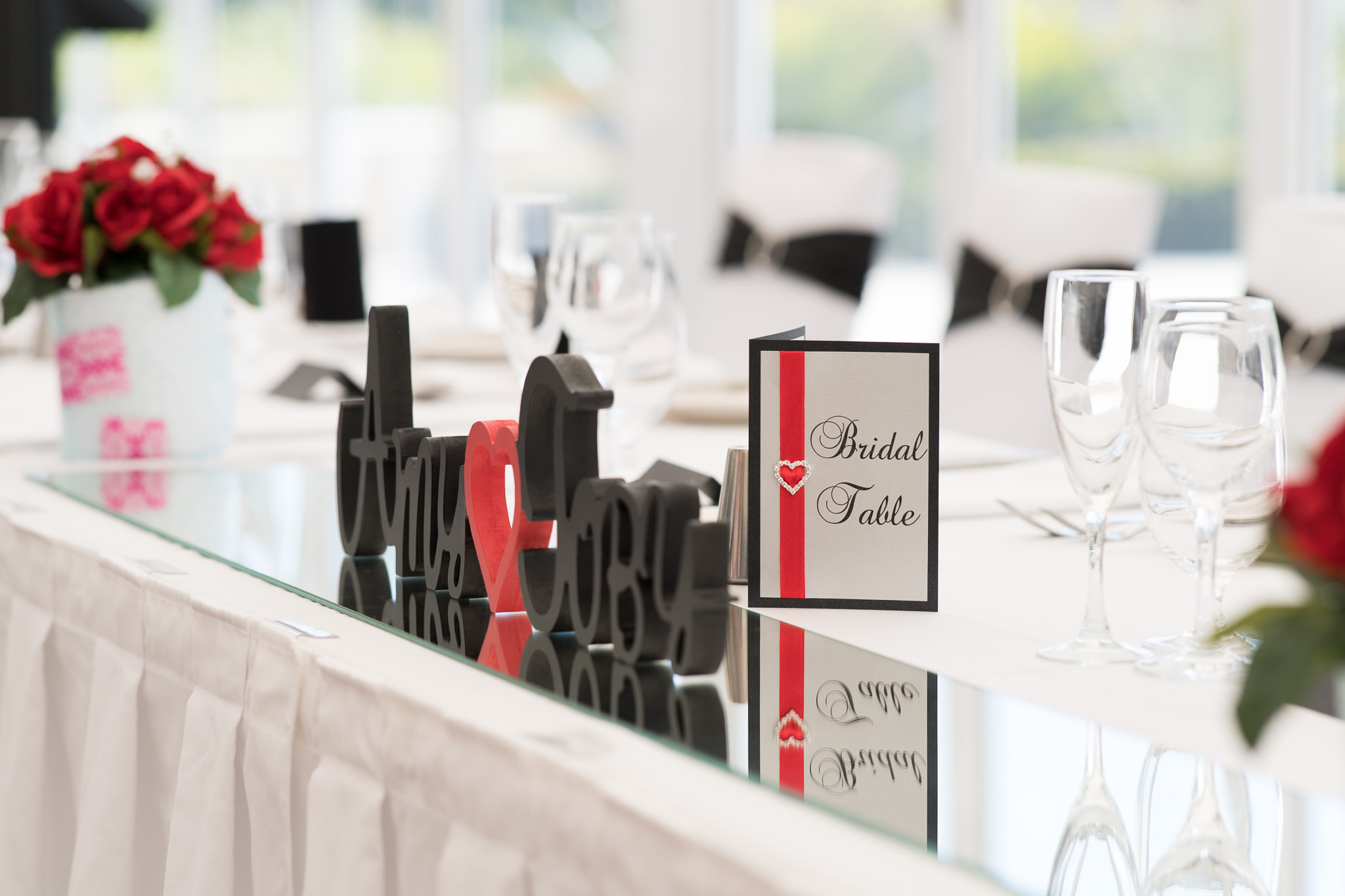 Black, white and red bridal table decorations at Joondalup golf resort