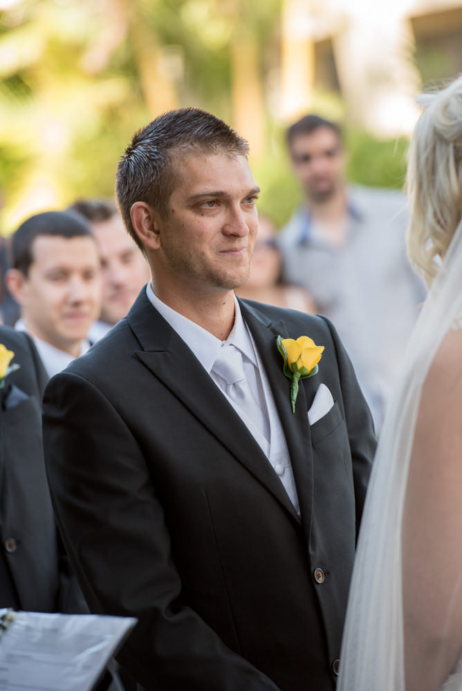 Groom looking at his bride during ceremony