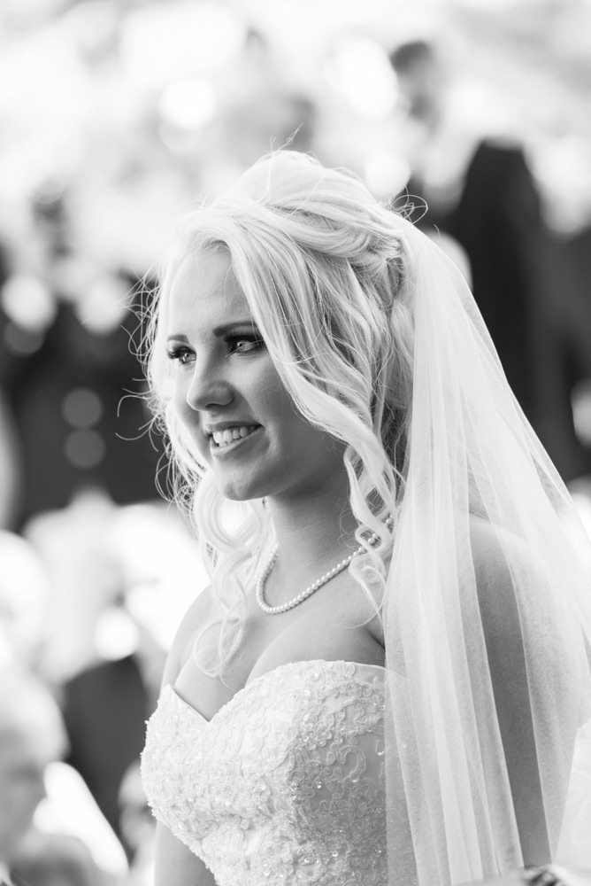 Bride smiles during ceremony