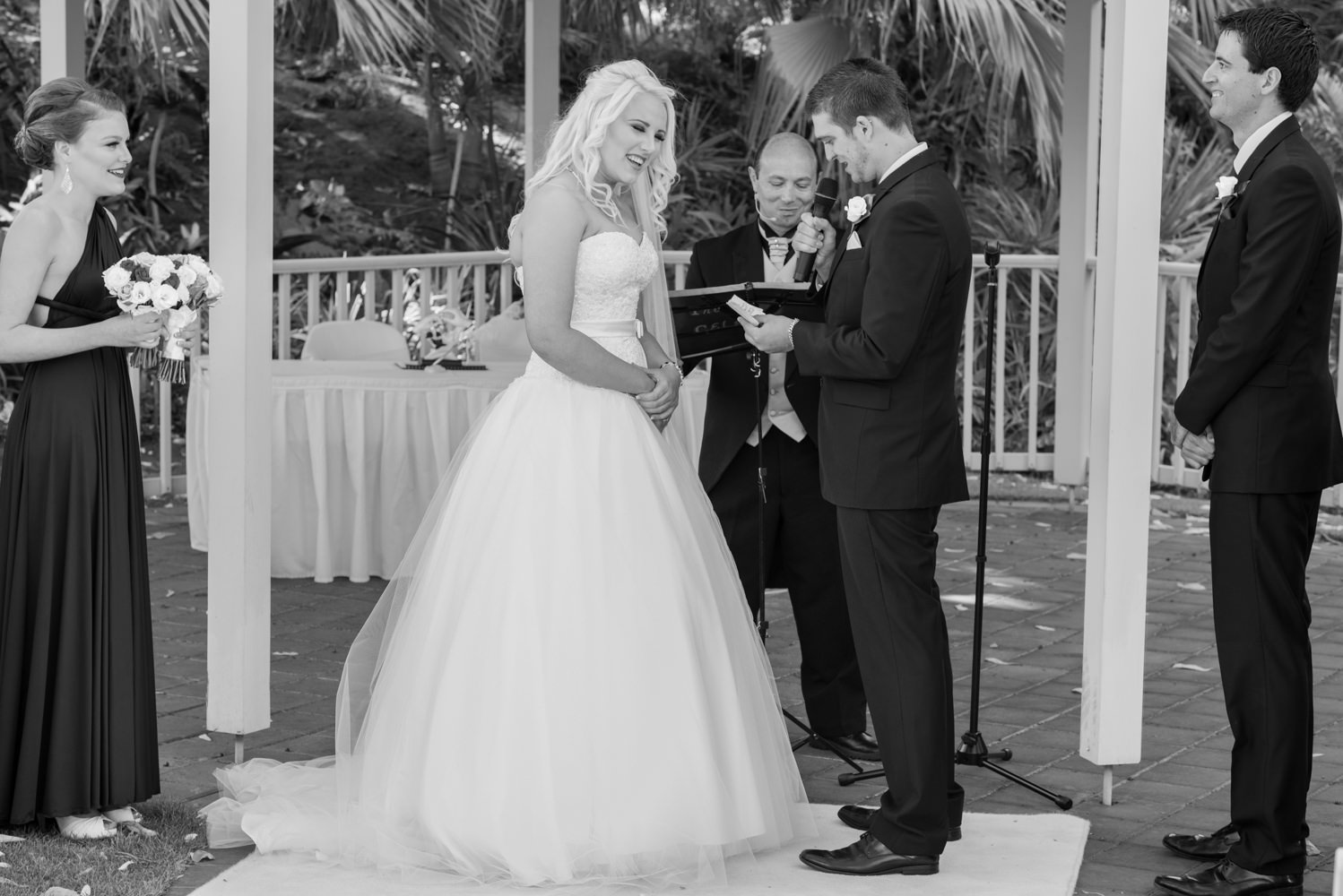 Bride laughs when groom says his vows