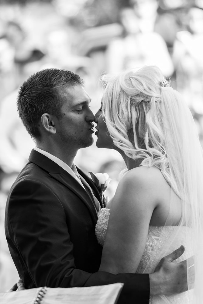 Bride and groom kiss