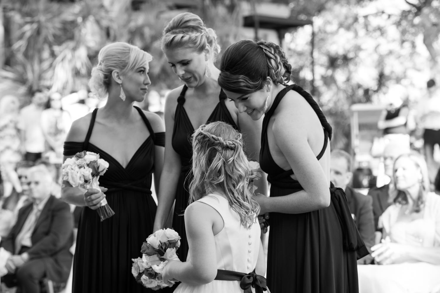 Candid moment with bridesmaids and flower girl