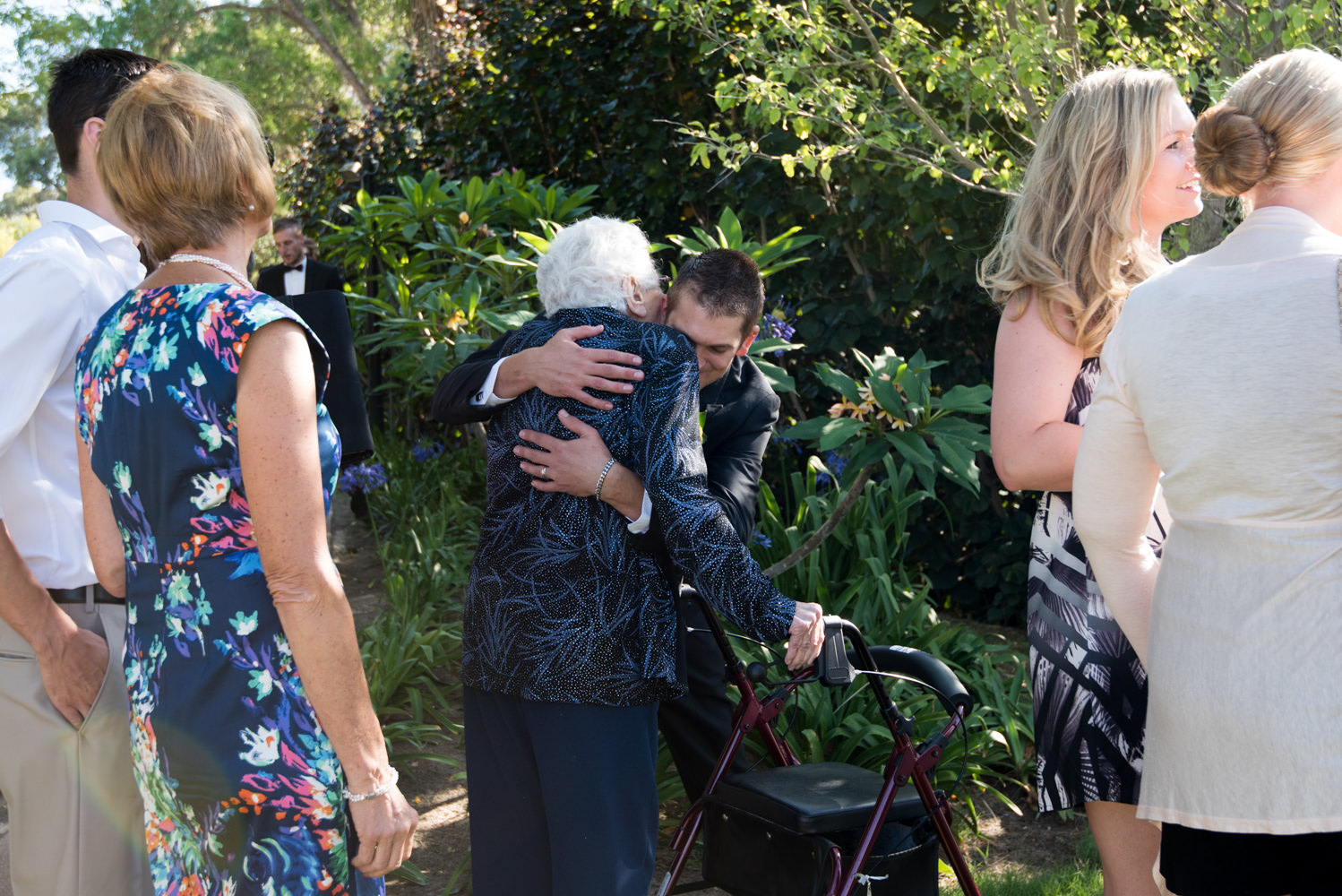 Groom hugging grandma