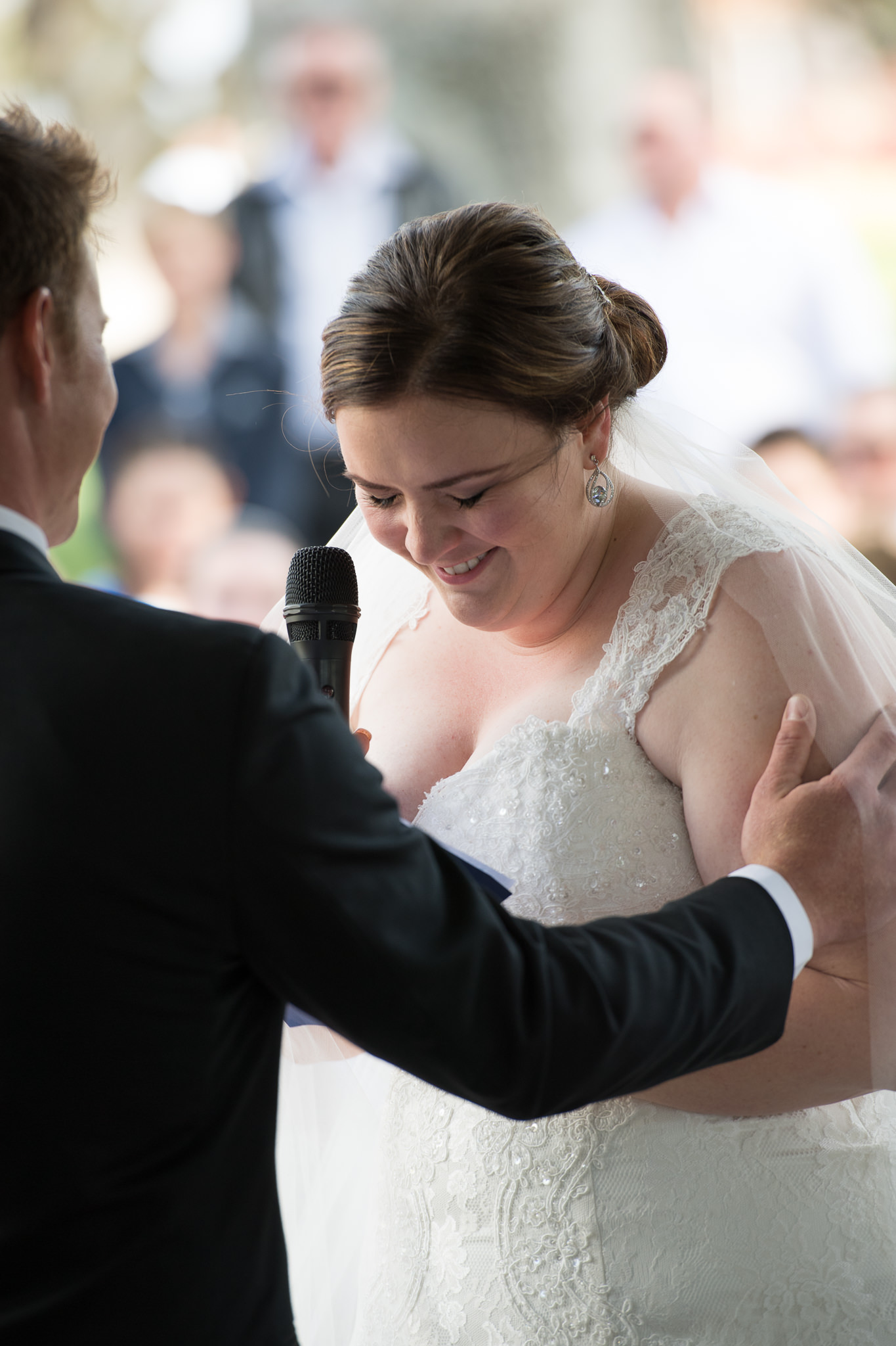 bride laughs during her vows