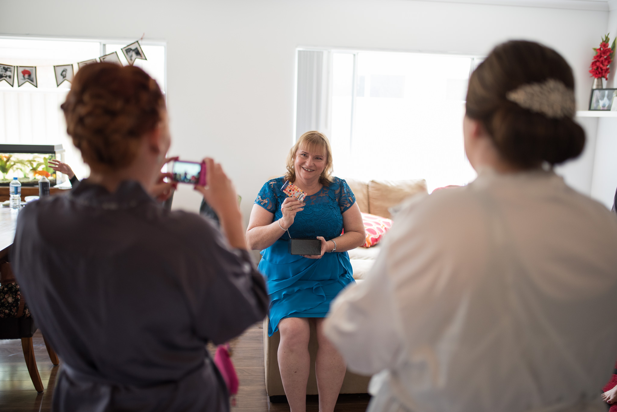 bride's mother opens her gift