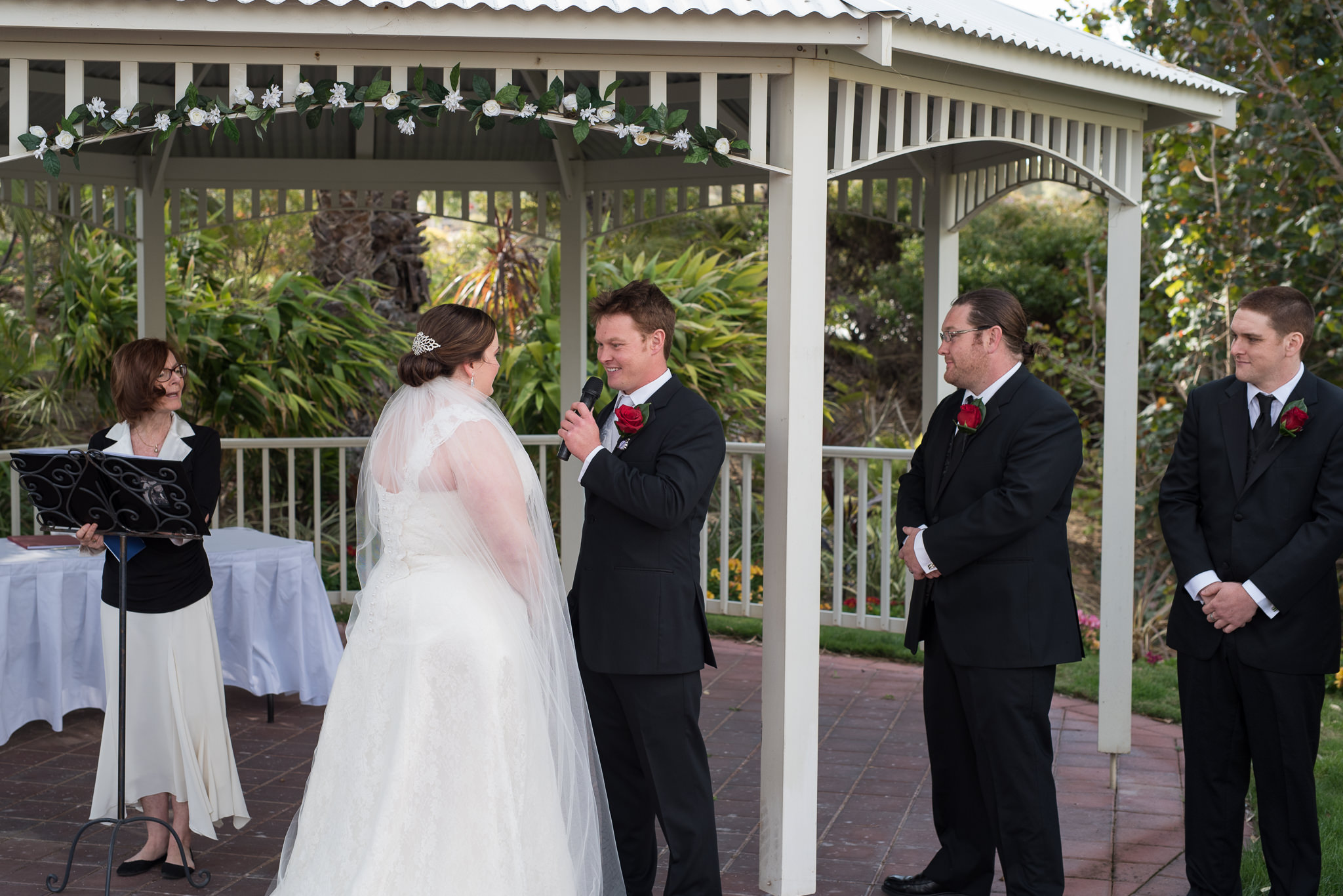 groom says his vows to his bride