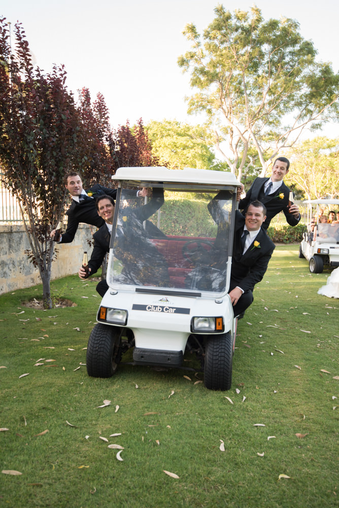 Groomsmen in their golf cart