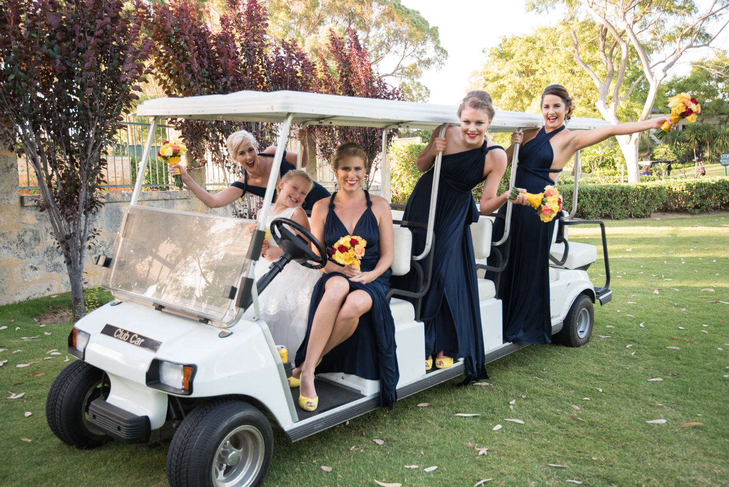 Bridesmaids in the golf cart