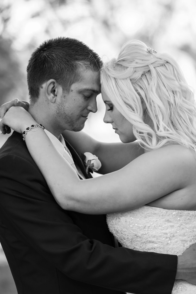 Bride and groom heads together