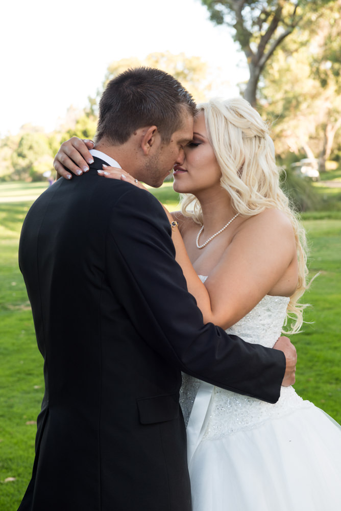 Bride and groom almost kissing