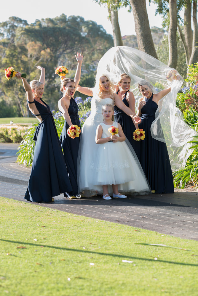 Bride and bridesmaids laughing