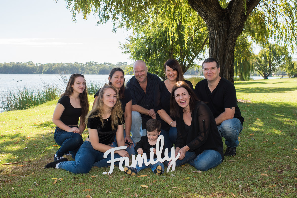 Family photo with Family sign at Lake Monger