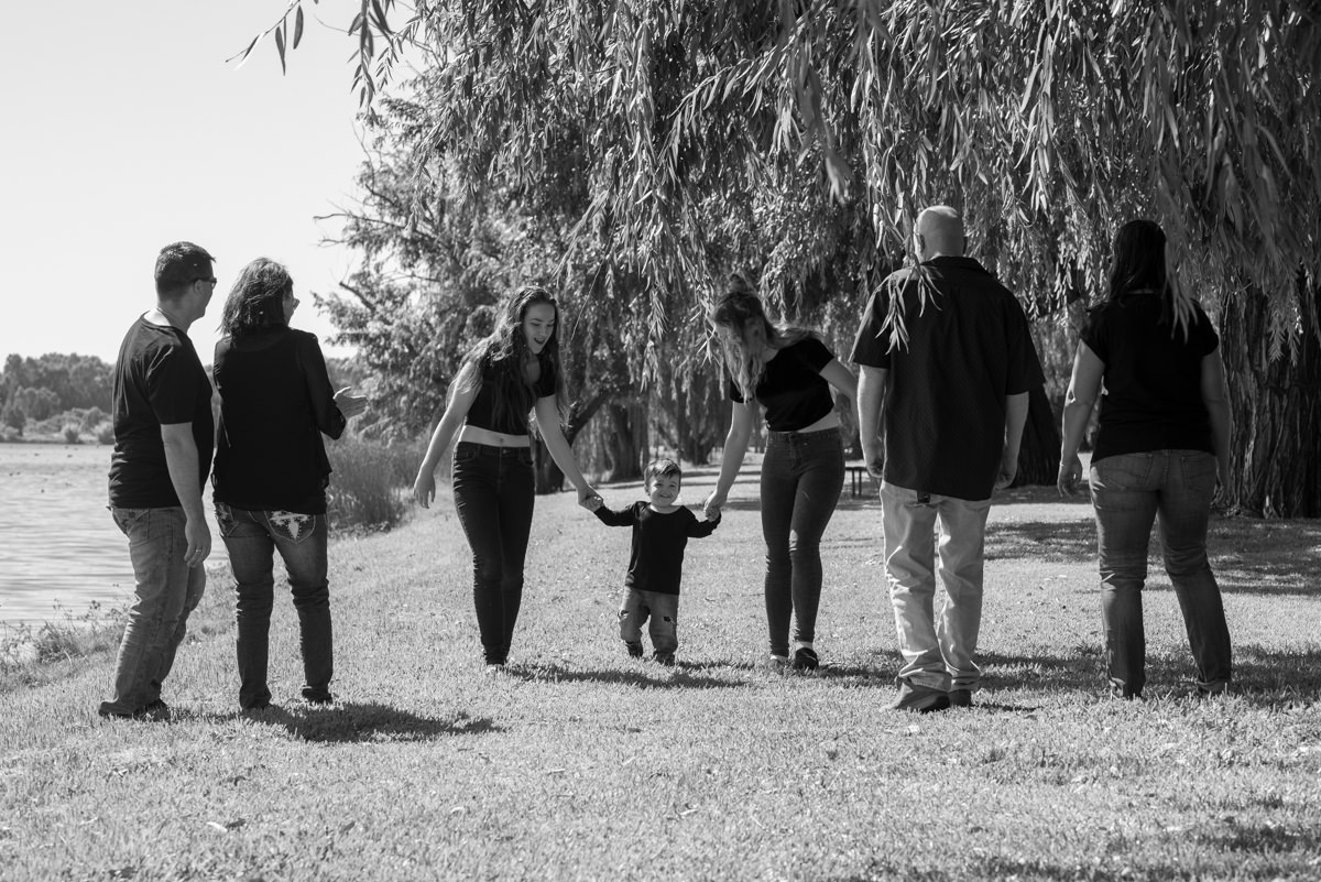 Black and white family photo at the edge of Lake Monger