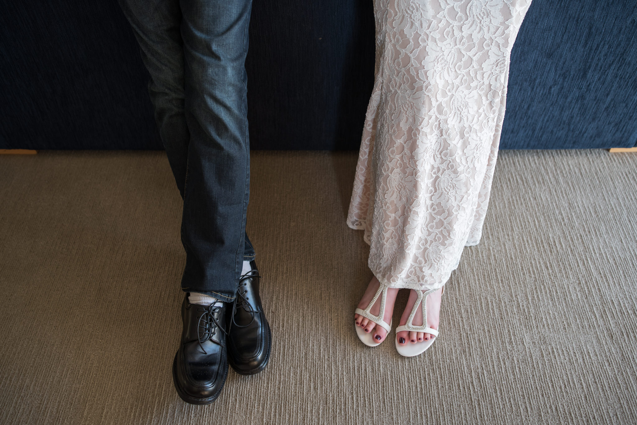 Close up of bride and groom's lower bodies and shoes