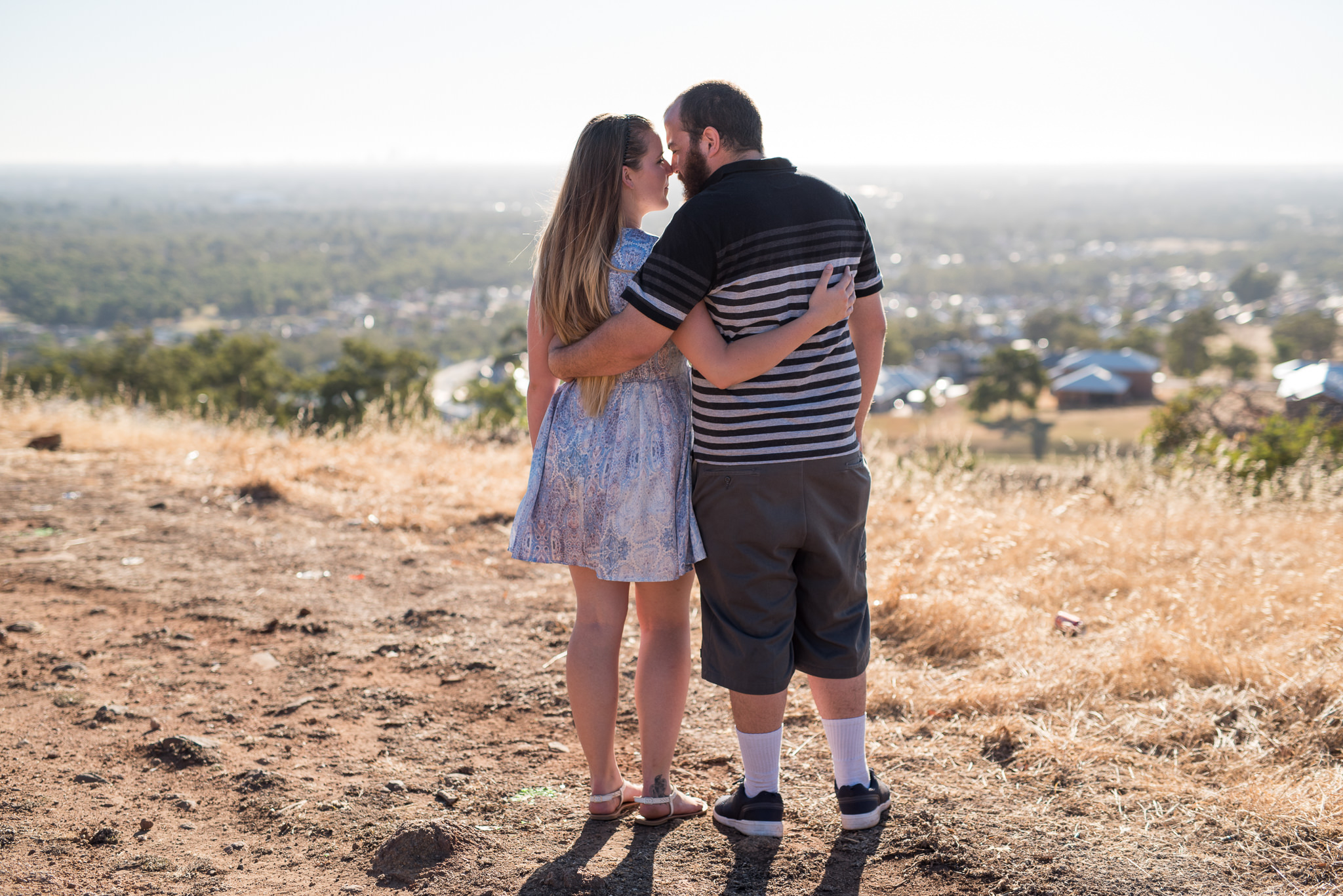 view of Perth from high hill and young couple with arm around each other