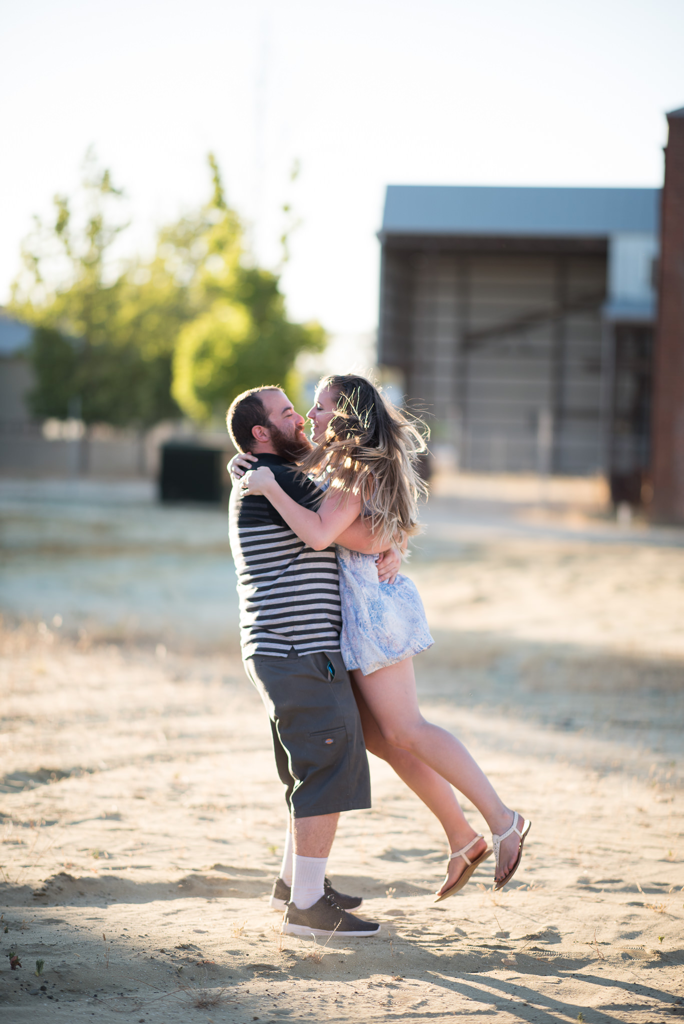 guy picks up his fiancee and swings her around