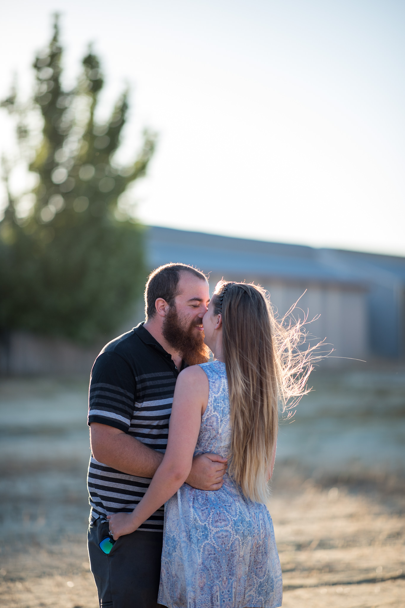 engaged couple having fun cuddling