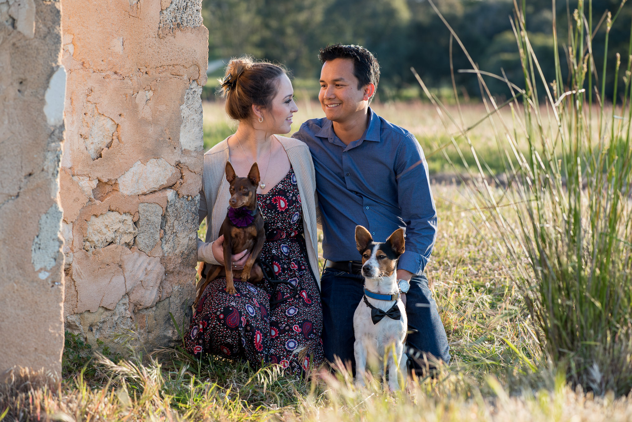 couple kneeling with their dogs at Yellagonga park