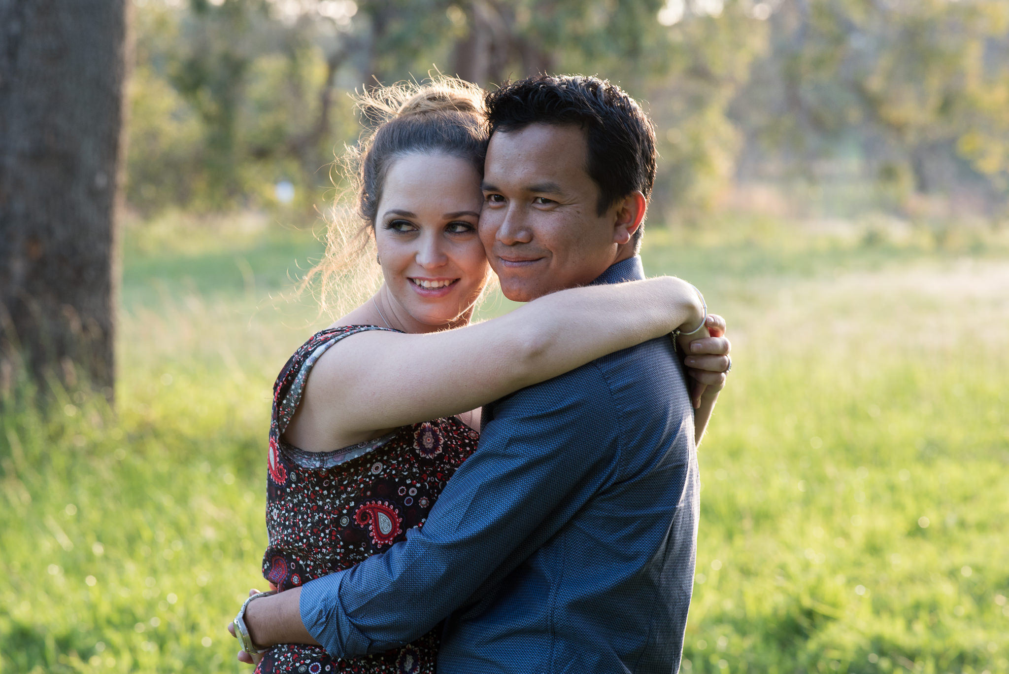 couple looking away smiling in Yellagonga park