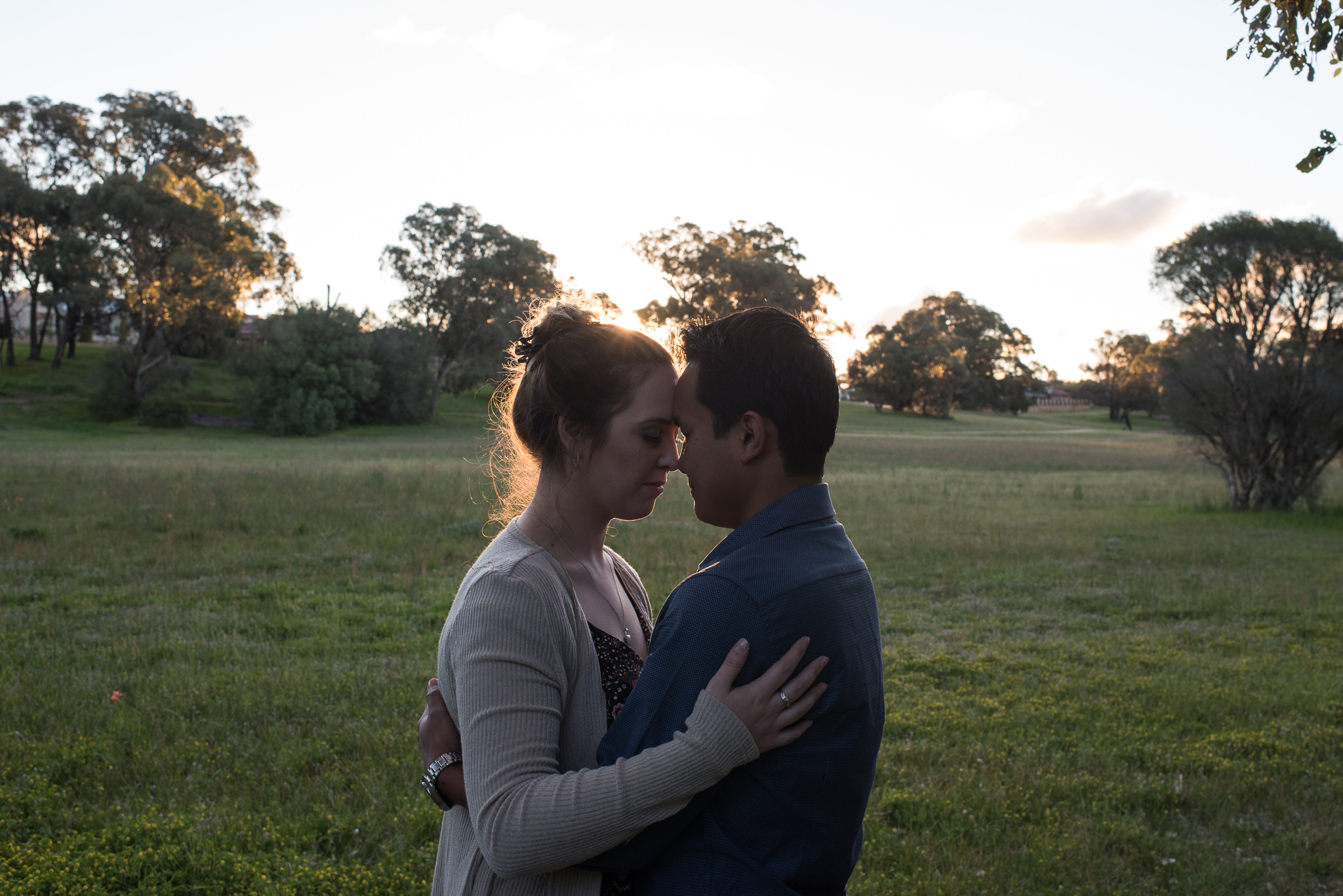 couple holding each other with eyes closed