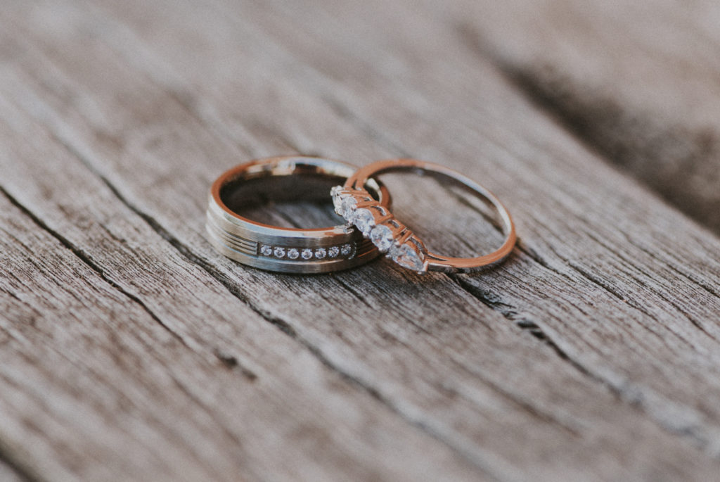 wedding rings on a wooden plank