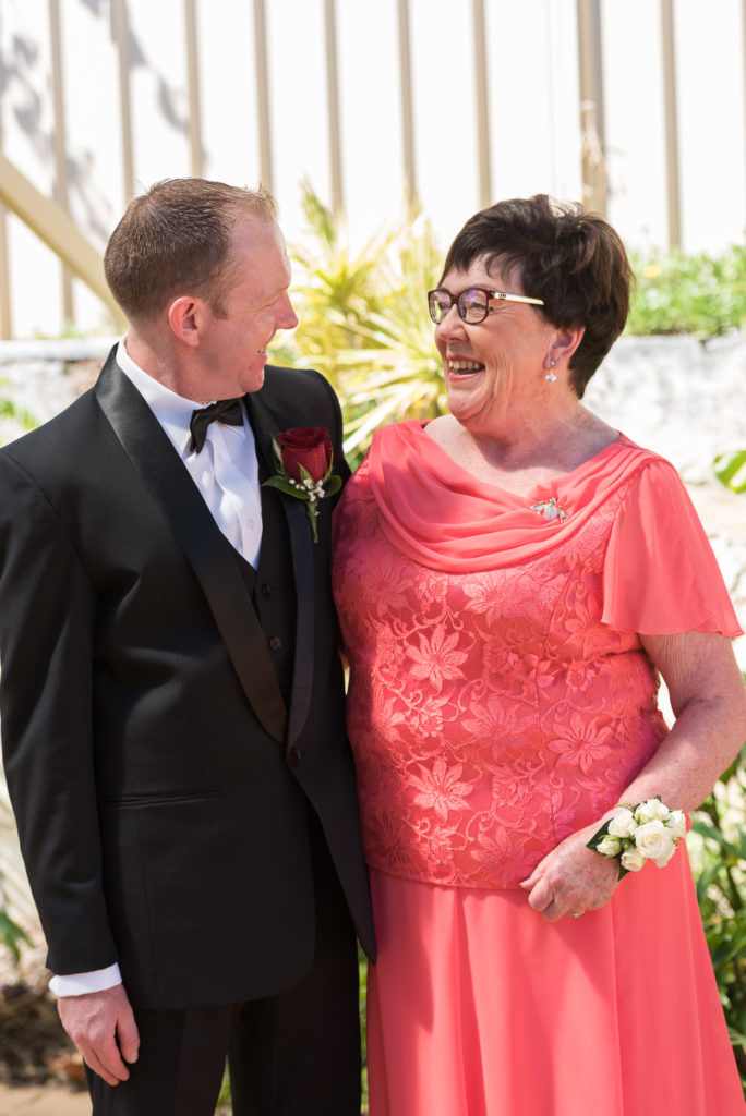 groom hugging his mum and looking at each other