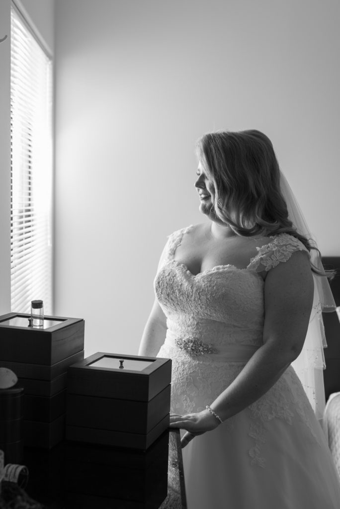 bride standing by her window