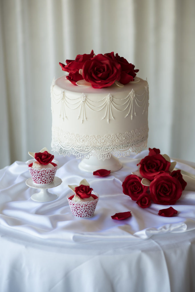 wedding cake with red roses