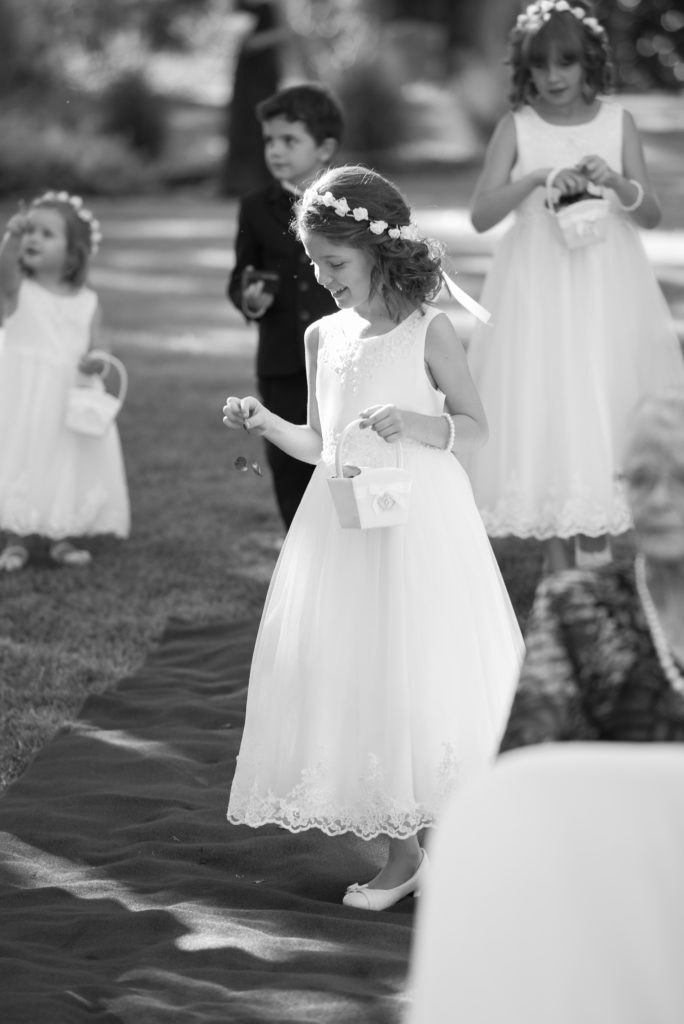 flower girls drop petals during wedding ceremony