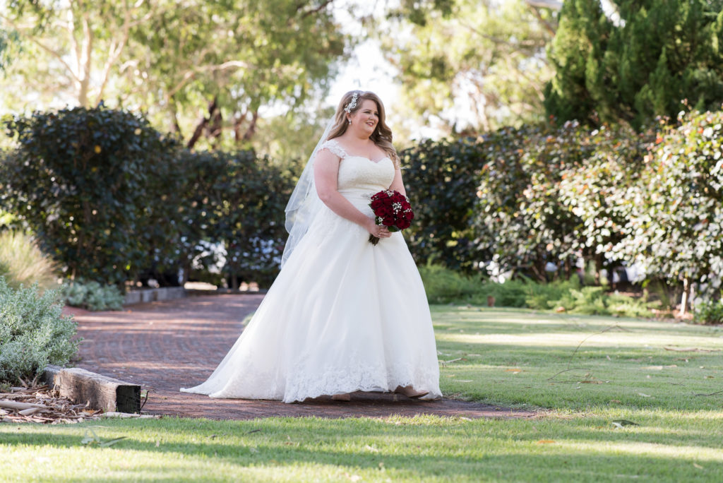 bride starts walking towards the wedding ceremony