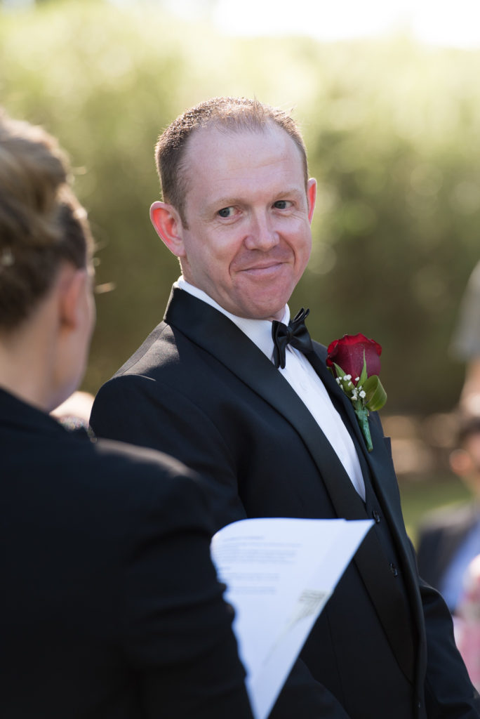 groom looking at celebrant