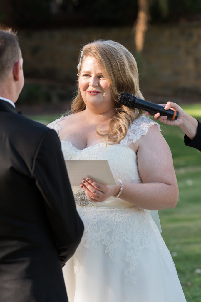 bride reads her vows to her groom