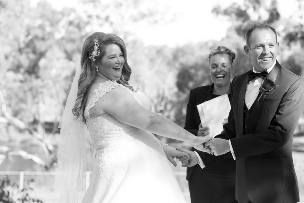 bride laughing during ceremony